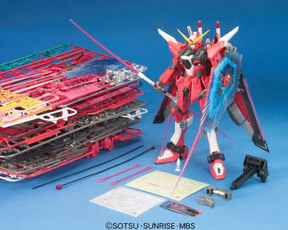 MG Infinite Justice Gundam model kit built alongside unbuilt kit